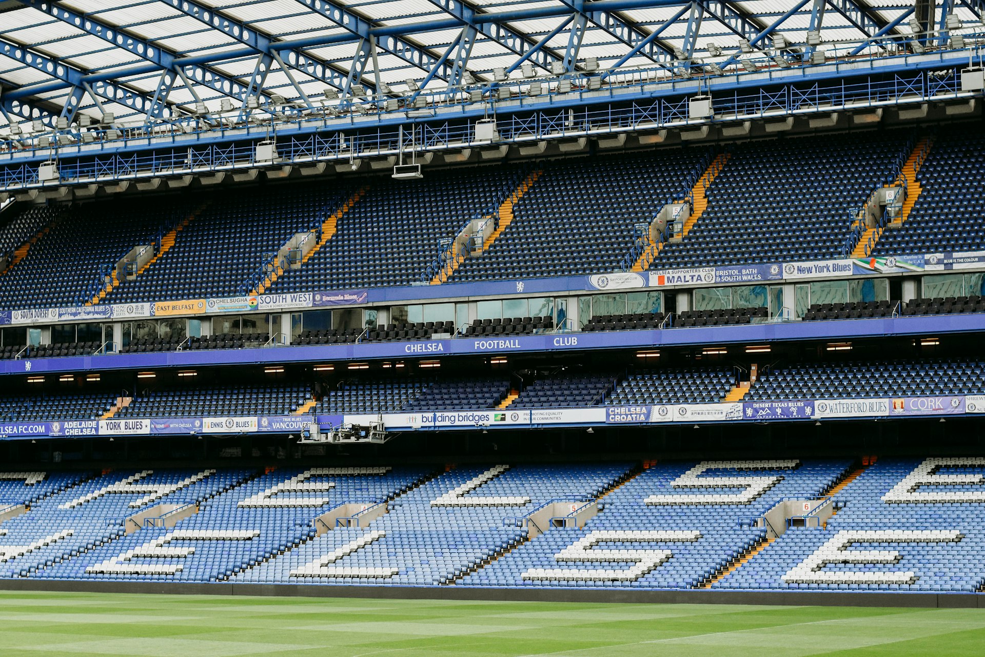 a stadium filled with lots of blue seats